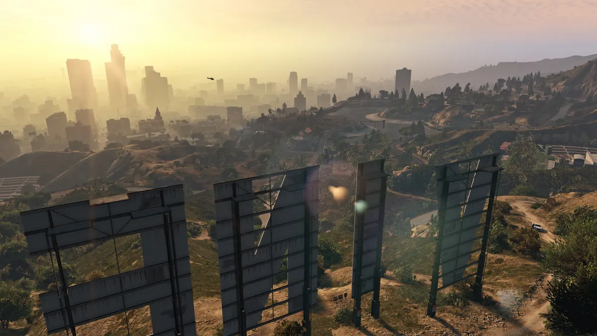 Hazy Los Santos skyline seen from behind the Vinewood sign letters in GTA V